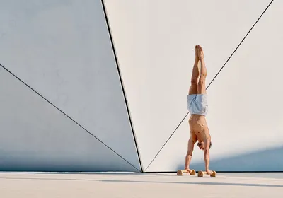 Handstand on Eric Flag wooden parallettes